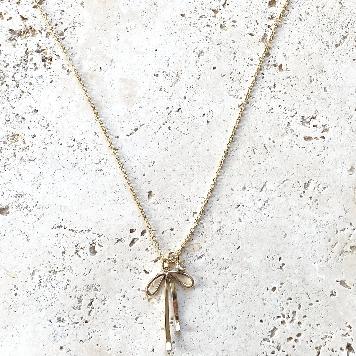 Droopy Ribbon Melted droopy ribbon bow charm necklace trendy – VB&Co. Designs Jewelry